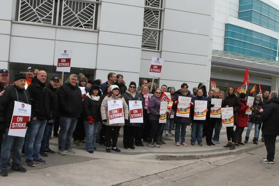Members standing together on a strike line