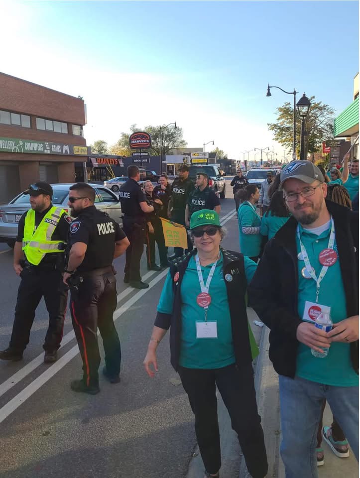 Members and police near a community action