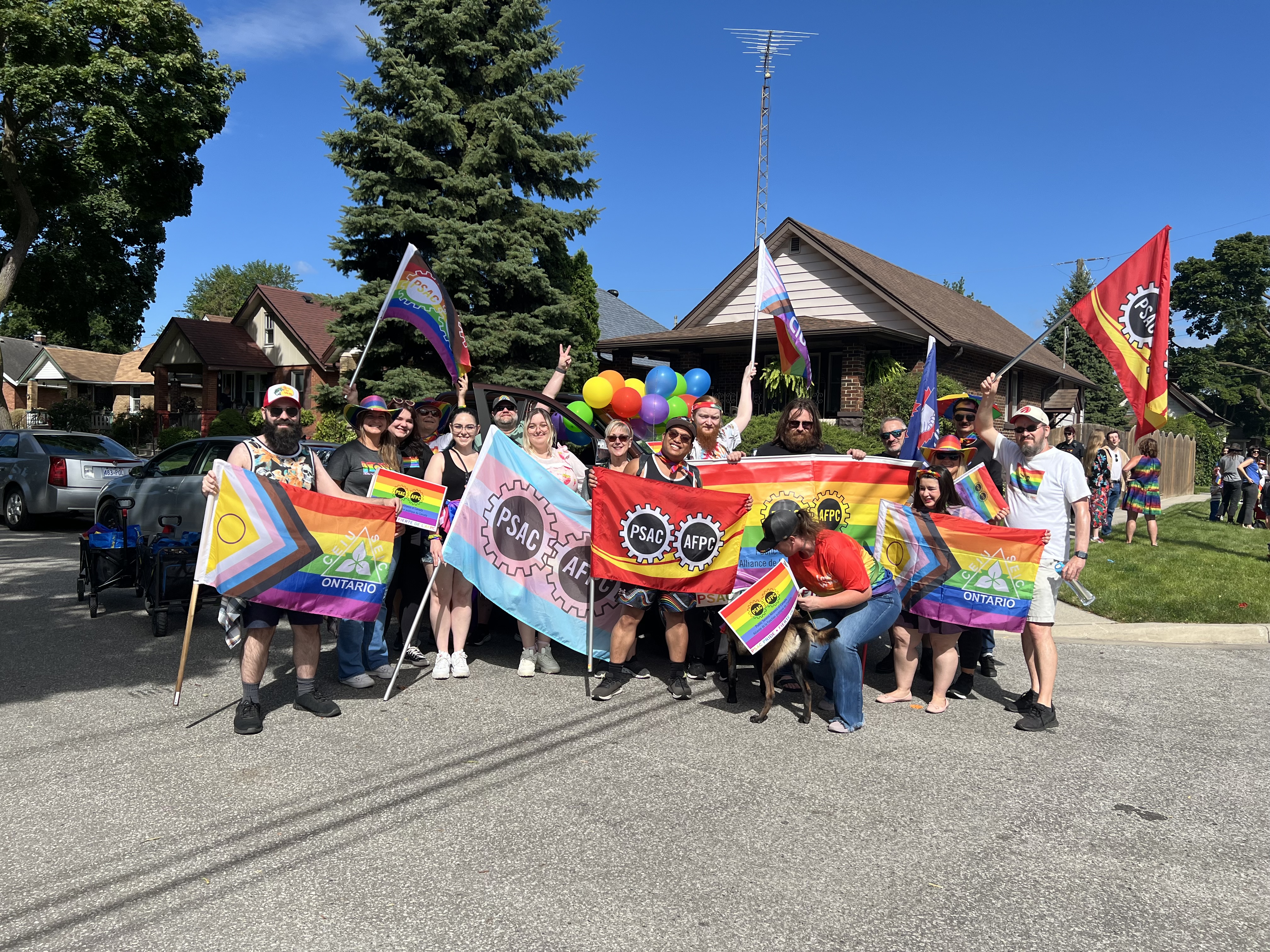 Members holding labour and Pride flags